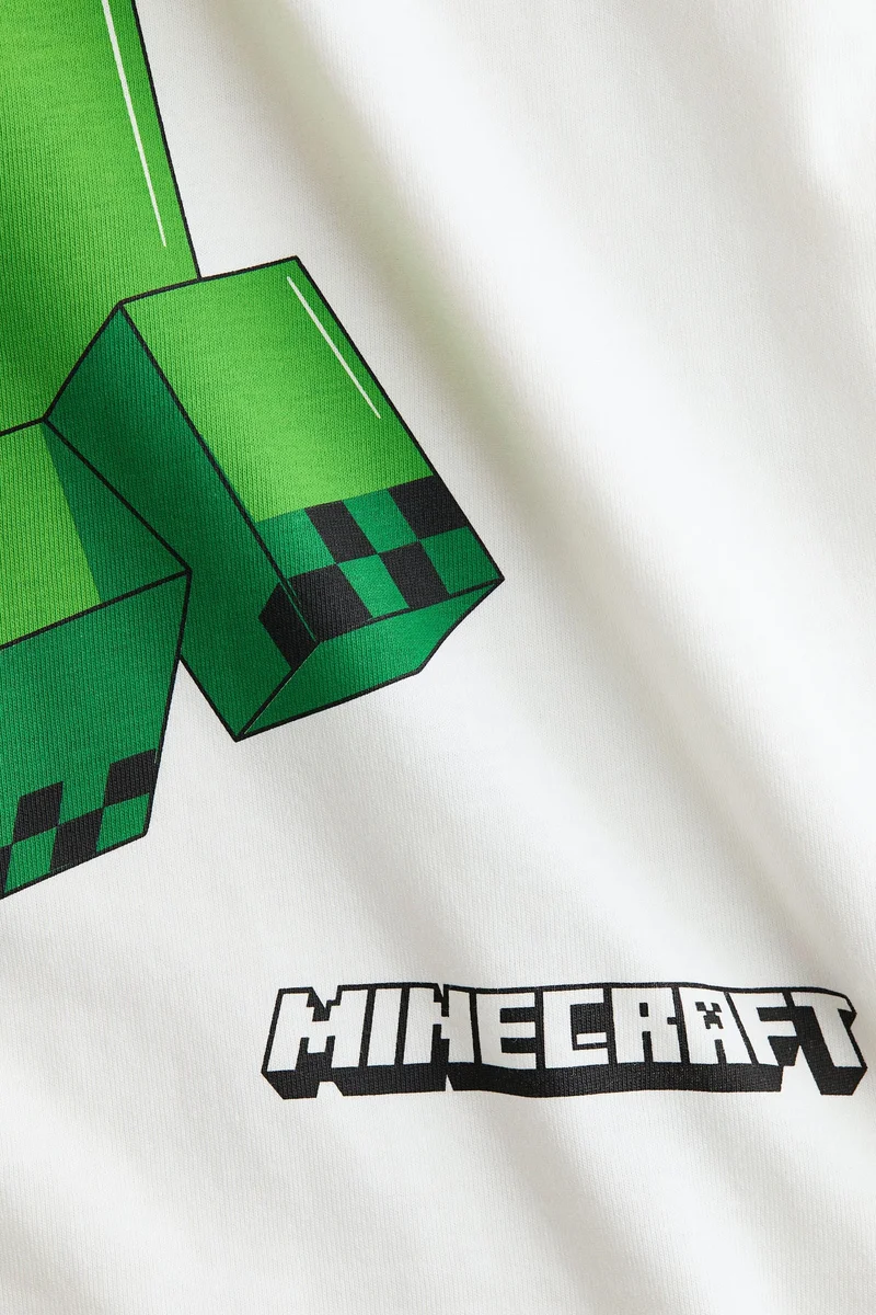 اتش اند ام تي-شيرت فضفاض بطبعة مميزة